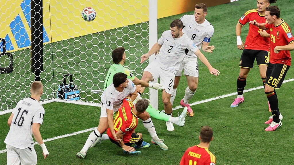 Belgium's Leandro Trossard (10) collides with New Zealand's Liberato Cacace (13) as the ball goes into the net over New Zealand goalkeeper Max Crocombe (1) for the first goal during the World Cup Group G soccer match between New Zealand and Belgium in Vancouver, British Columbia, Friday, June 26, 2026. - AP Photo/Emma Peterson