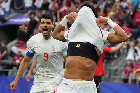 Iran's Ramin Rezaeian (23) celebrates after scoring during the World Cup Group G soccer match between Egypt and Iran in Seattle, Friday, June 26, 2026