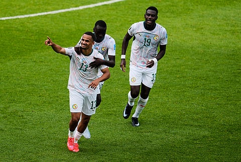 Senegal's Iliman Ndiaye (13) celebrates Senegal's fifth goal during the World Cup Group I soccer match between Senegal and Iraq in Toronto.