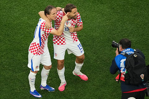 Croatia's Luka Modric (10) and Nikola Vlasic (13) celebrate a win during the World Cup Group L soccer match between Croatia and Ghana in Philadelphia, Saturday, June 27, 2026.