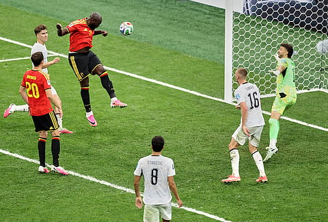Belgium's Romelu Lukaku (9) heads the ball into the goal for his team's fourth goal during the World Cup Group G soccer match between New Zealand and Belgium in Vancouver, British Columbia.