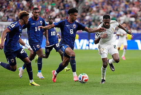 Cape Verde's Kevin Pina (6) dribbles the ball against Saudi Arabia's Mohamed Kanno (23) during the World Cup Group H soccer match between Cape Verde and Saudi Arabia in Houston.
