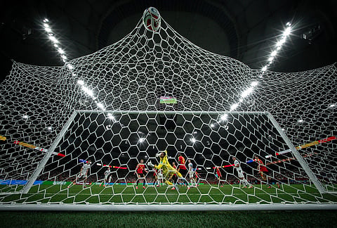 Belgium goalkeeper Thibaut Courtois (1) looks back at the ball after New Zealand's Elijah Just, not seen, scored a goal during the World Cup Group G soccer match between New Zealand and Belgium in Vancouver, British Columbia.