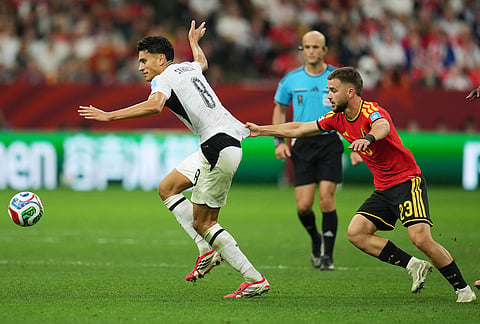 Belgium's Nicolas Raskin (23) holds onto New Zealand's Marko Stamenic (8) during the World Cup Group G soccer match between New Zealand and Belgium in Vancouver, British Columbia.
