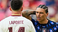AP/Ricardo Mazalan : Uruguay's Darwin Nunez (9) talks to Spain's Aymeric Laporte (14) during the World Cup Group H soccer match