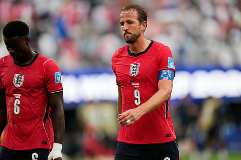 England's Harry Kane (9) and Marc Guehi (6) walk off the pitch at halftime during the World Cup Group L soccer match between Panama and England in East Rutherford
