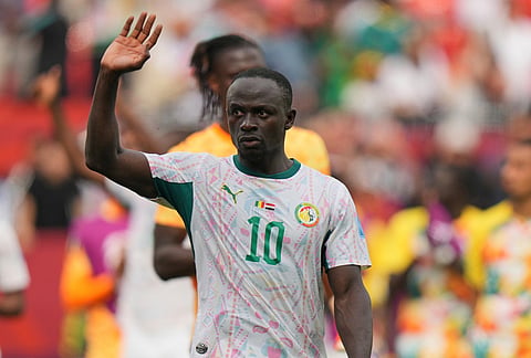 Senegal's Sadio Mane (10) waves to supporters as he walks off the pitch after their win in the World Cup Group I soccer match between Senegal and Iraq in Toronto.