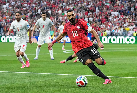 Egypt's Mohamed Salah (10) runs ahead with the ball during the World Cup Group G soccer match between Egypt and Iran in Seattle.