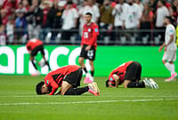 | Photo: AP/Lindsey Wasson : Egypt players react at the end of the World Cup Group G soccer match between Egypt and Iran in Seattle.