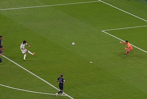 Spain's Ferran Torres (7) shoots against Uruguay goalkeeper Fernando Muslera (23) during the World Cup Group H soccer match between Uruguay and Spain in Zapopan, near Guadalajara, Mexico.
