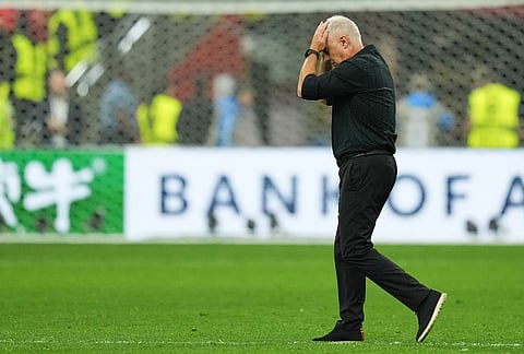 New Zealand head coach Darren Bazeley walks from the field following the World Cup Group G soccer match between New Zealand and Belgium in Vancouver, British Columbia.