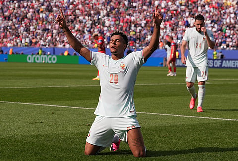 France's Desire Doue (20) celebrates after scoring his side's fourth goal during the World Cup Group I soccer match between Norway and France in Foxborough, Mass., near Boston.