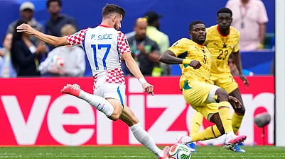 (AP Photo/Petr Josek) : Croatias Petar Sucic (17) scores the opening goal during the World Cup Group L soccer match between Croatia and Ghana in Philadelphia, Saturday, June 27, 2026.