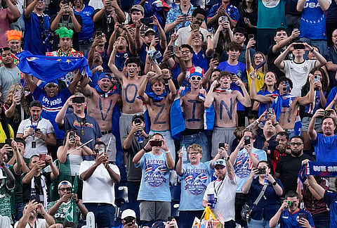 Supporters celebrate after the World Cup Group H soccer match between Cape Verde and Saudi Arabia in Houston.