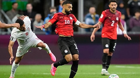 Egypt's Mohamed Salah (10) takes the ball away from Iran's Milad Mohammadi (5) during the World Cup Group G soccer match between Egypt and Iran in Seattle, Friday, June 26, 2026.