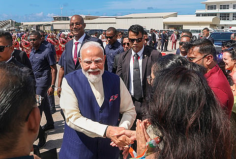 Prime Minister Narendra Modi being welcomed by members of the Indian community and others upon his arrival at the airport, in Victoria, Seychelles. Seychelles President Patrick Herminie is also seen. 