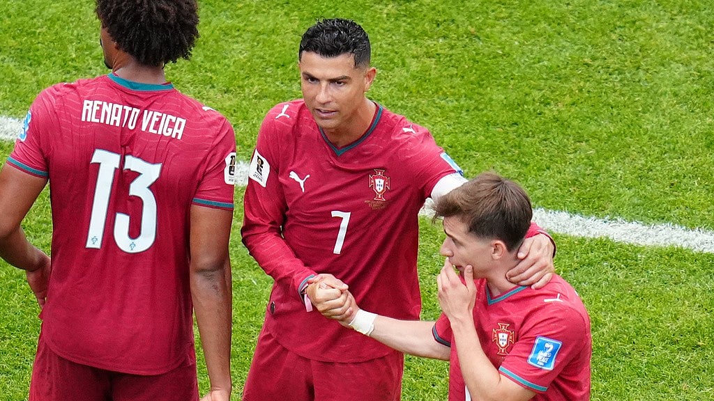 Portugal's Cristiano Ronaldo (7) and Portugal's Francisco Conceicao (26) celebrate after the World Cup Group K soccer match between Portugal and Uzbekistan in Houston. - Karen Warren/AP Photo