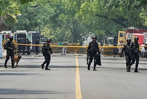 National Security Guard (NSG) personnel with its sniffer dog during a mock drill, outside Israeli Embassy, in New Delhi.