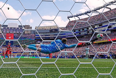 Norway goalkeeper Egil Selvik (13) receives the second goal by France's Ousmane Dembele (7) during the World Cup Group I soccer match between Norway and France in Foxborough, Mass., near Boston.