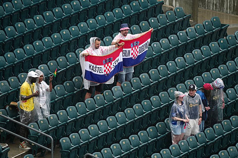 Croatia supporters stand in the rain before the World Cup Group L soccer match between Croatia and Ghana in Philadelphia, Saturday, June 27, 2026.