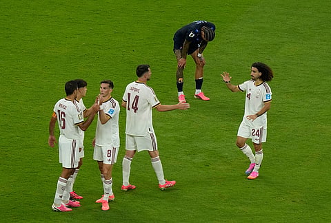Spain players celebrate after winning the World Cup Group H soccer match between Uruguay and Spain in Zapopan, near Guadalajara, Mexico.