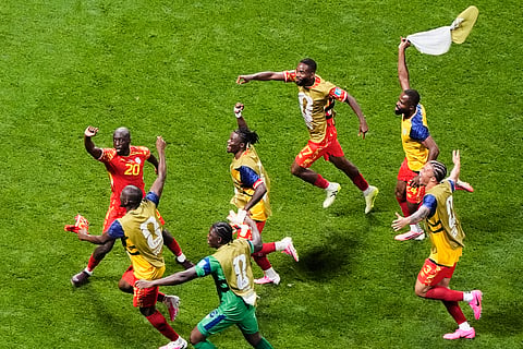 Congo's Yoane Wissa (20) celebrates with teammates after scoring their third goal during the World Cup Group K soccer match between DR Congo and Uzbekistan in Atlanta, Saturday, June 27, 2026.