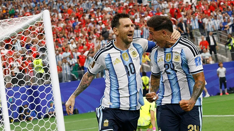 Argentina Lionel Messi (10) celebrates with Enzo Fernández (24) after scoring their first goal of the game during the World Cup Group J soccer match between Argentina and Austria in Arlington - Chitose Suzuki/AP Photo