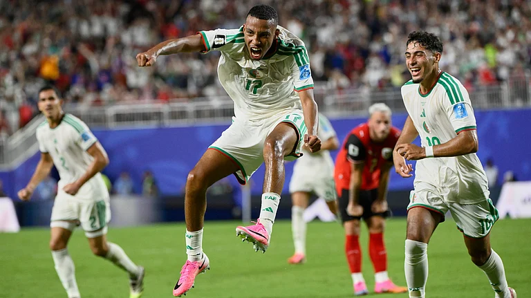 Algeria's Rafik Belghali (17)celebrates after scoring his team's first goal during the World Cup Group J soccer match between Algeria and Austria in Kansas City, Mo., Saturday, June 27, 2026 - (AP Photo/Reed Hoffmann)