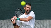 Kin Cheung/AP Photo : Novak Djokovic of Serbia practices one day ahead of the start of the Wimbledon Tennis Championships in London.