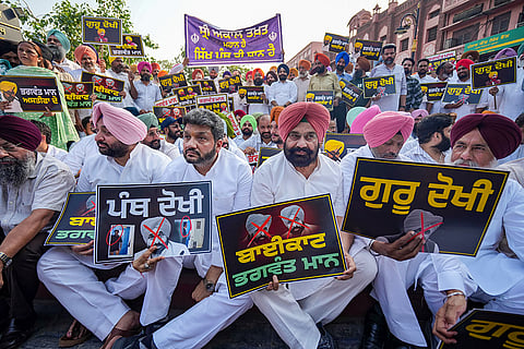 Congress leaders stage a protest against Punjab Chief Minister Bhagwant Mann, in Amritsar, Punjab. LoP in the Punjab Legislative Assembly Partap Singh Bajwa demands Chief Minister Bhagwant Mann and his cabinet to appear before the Akal Takht Sahib instead of challenging its authority.