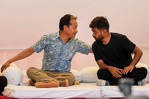 Activist Sonam Wangchuk in a conversation with Cockroach Janta Party (CJP) founder Abhijeet Dipke during a protest demanding the resignation of Union Education Minister Dharmendra Pradhan in the wake of the alleged NEET paper leak, at Jantar Mantar in New Delhi.