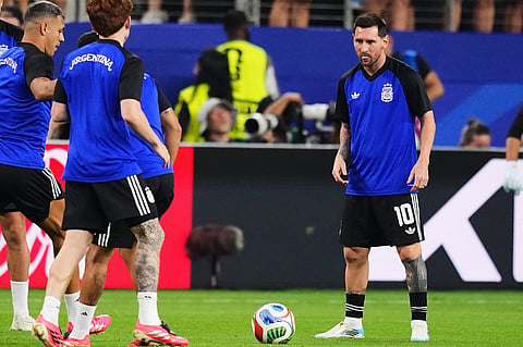 Argentina's Lionel Messi, right, warms up ahead of the World Cup Group J soccer match against Jordan in Arlington, Texas, near Dallas, Saturday, June 27, 2026