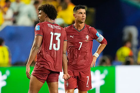 Portugal's Cristiano Ronaldo (7) reacts with teammate Renato Veiga (13) following during the World Cup Group K soccer match between Colombia and Portugal in Miami Gardens, Fla., Saturday, June 27, 2026