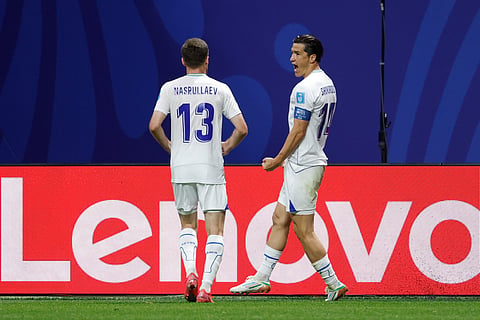 Uzbekistan's Eldor Shomurodov (14) celebrates after scoring their first goal during the World Cup Group K soccer match between DR Congo and Uzbekistan in Atlanta, Saturday, June 27, 2026.