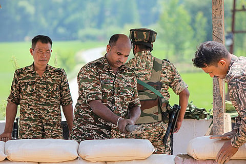 Security personnel prepare sandbag fortifications at a security checkpoint along the Jammu-Srinagar National Highway as part of security arrangements ahead of the annual Amarnath Yatra, in Bijbehara, Anantnag district, Jammu and Kashmir.