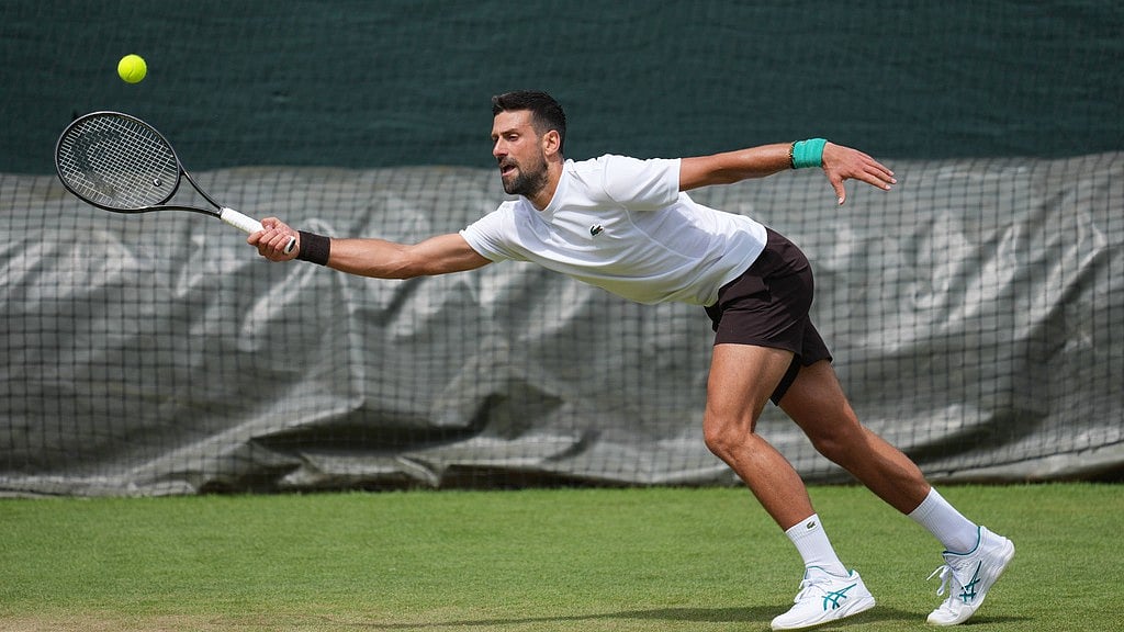 Novak Djokovic of Serbia practices one day ahead of the start of the Wimbledon Tennis Championships in London. - Kin Cheung/AP Photo