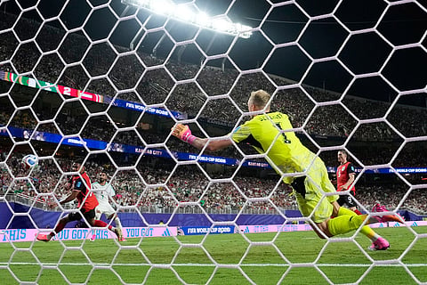 Algeria's Riyad Mahrez (7) scores their second goal past Austria goalkeeper Alexander Schlager (1) during the World Cup Group J soccer match between Algeria and Austria in Kansas City, Mo., Saturday, June 27, 2026.