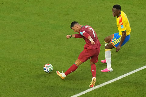Portugal's Cristiano Ronaldo (7) shoots against Colombia's Jhon Lucumi (3) during the World Cup Group K soccer match between Colombia and Portugal in Miami Gardens