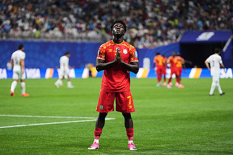 Congo's Nathanael Mbuku (7) celebrates after scoring a goal, that was call back after video review, during the World Cup Group K soccer match between DR Congo and Uzbekistan in Atlanta, 