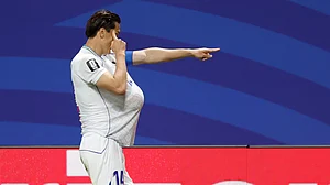 (AP Photo/Erik S.Lesser) : Uzbekistans Eldor Shomurodov (14) celebrates after scoring their first goal during the World Cup Group K soccer match between DR Congo and Uzbekistan in Atlanta, Saturday, June 27, 2026.