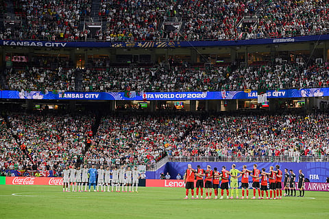 Algeria and Austria players observe a minute of silence for victims of the earthquake in Venezuela before the World Cup Group J soccer match between Algeria and Austria in Kansas City, Mo., Saturday, June 27, 2026.