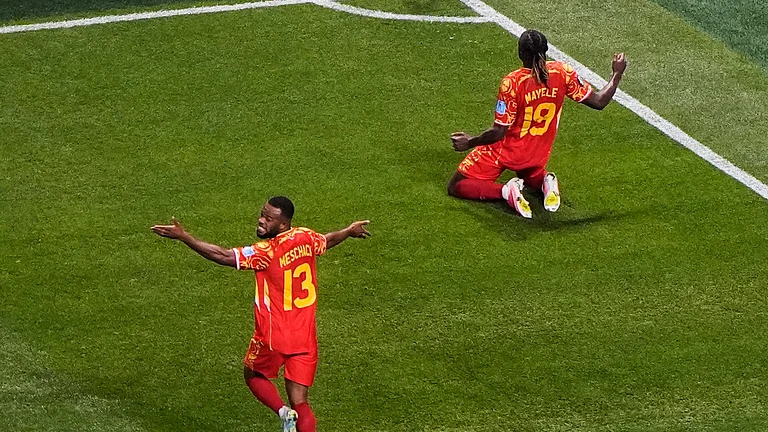 Congo's Fiston Mayele (19) celebrates with Meschack Elia (13) after scoring their second goal during the World Cup Group K soccer match between DR Congo and Uzbekistan in Atlanta, Saturday, June 27, 2026. - (AP Photo/Mike Stewart)