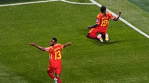 (AP Photo/Mike Stewart) : Congos Fiston Mayele (19) celebrates with Meschack Elia (13) after scoring their second goal during the World Cup Group K soccer match between DR Congo and Uzbekistan in Atlanta, Saturday, June 27, 2026.