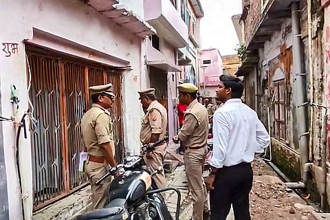Police officials conduct a search operation at the residence of an accused in connection with an alleged embezzlement of donations at the Ram temple, in Ayodhya, Uttar Pradesh.
