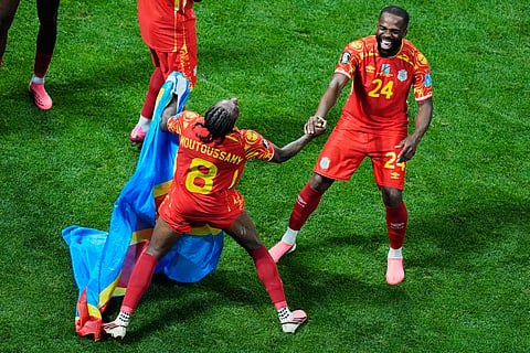 Congo's Samuel Moutoussamy (8) and Gedeon Kalulu (24) celebrate after the World Cup Group K soccer match between DR Congo and Uzbekistan in Atlanta, Saturday, June 27, 2026