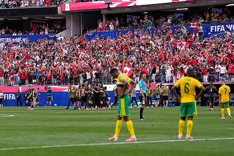 Canada's players celebrate their team first goal against South Africa during the World Cup round of 32 soccer match 
