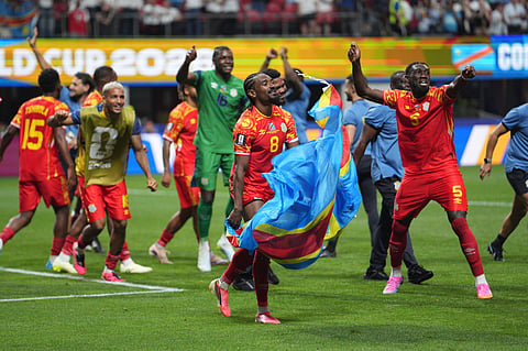 Congo's Samuel Moutoussamy (8) and Congo's Dylan Batubinsika (5) join other teammates in celebrating a win after the World Cup Group K soccer match between DR Congo and Uzbekistan in Atlanta, Saturday, June 27, 2026