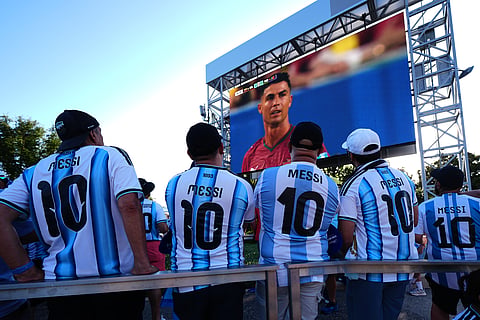 Argentina supporters watch a broadcast of the World Cup Group K soccer match between Colombia and Portugal, as Portugal's Cristiano Ronaldo is displayed, ahead of the World Cup Group J soccer match between Jordan and Argentina in Arlington, Texas, near Dallas, Saturday, June 27, 2026