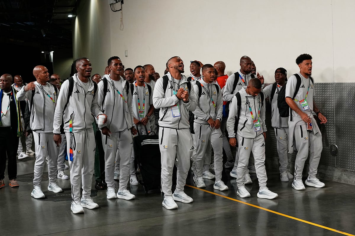South Africa's national soccer team sings upon their arrival for the World Cup round of 32 soccer match against Canada - AP/Gregory Bull