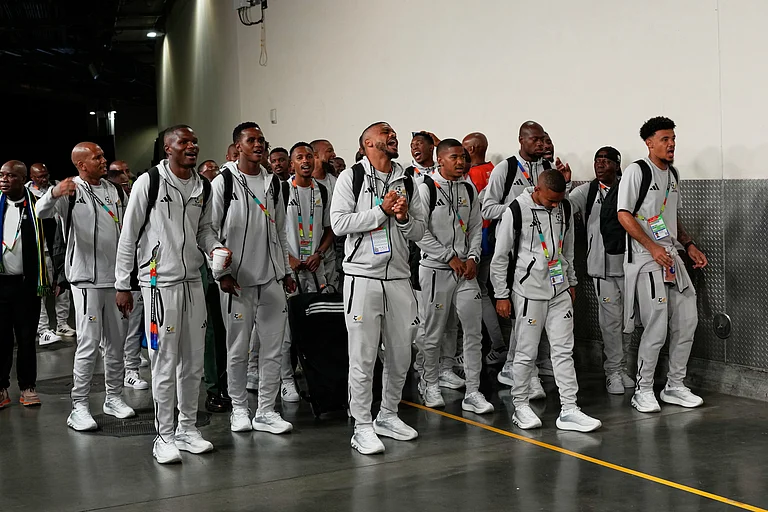 South Africa's national soccer team sings upon their arrival for the World Cup round of 32 soccer match against Canada - AP/Gregory Bull